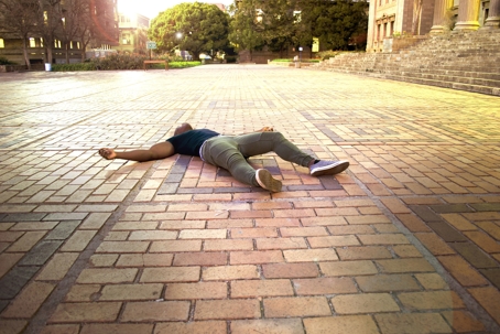 person lying on the ground injured after a slip and fall accident